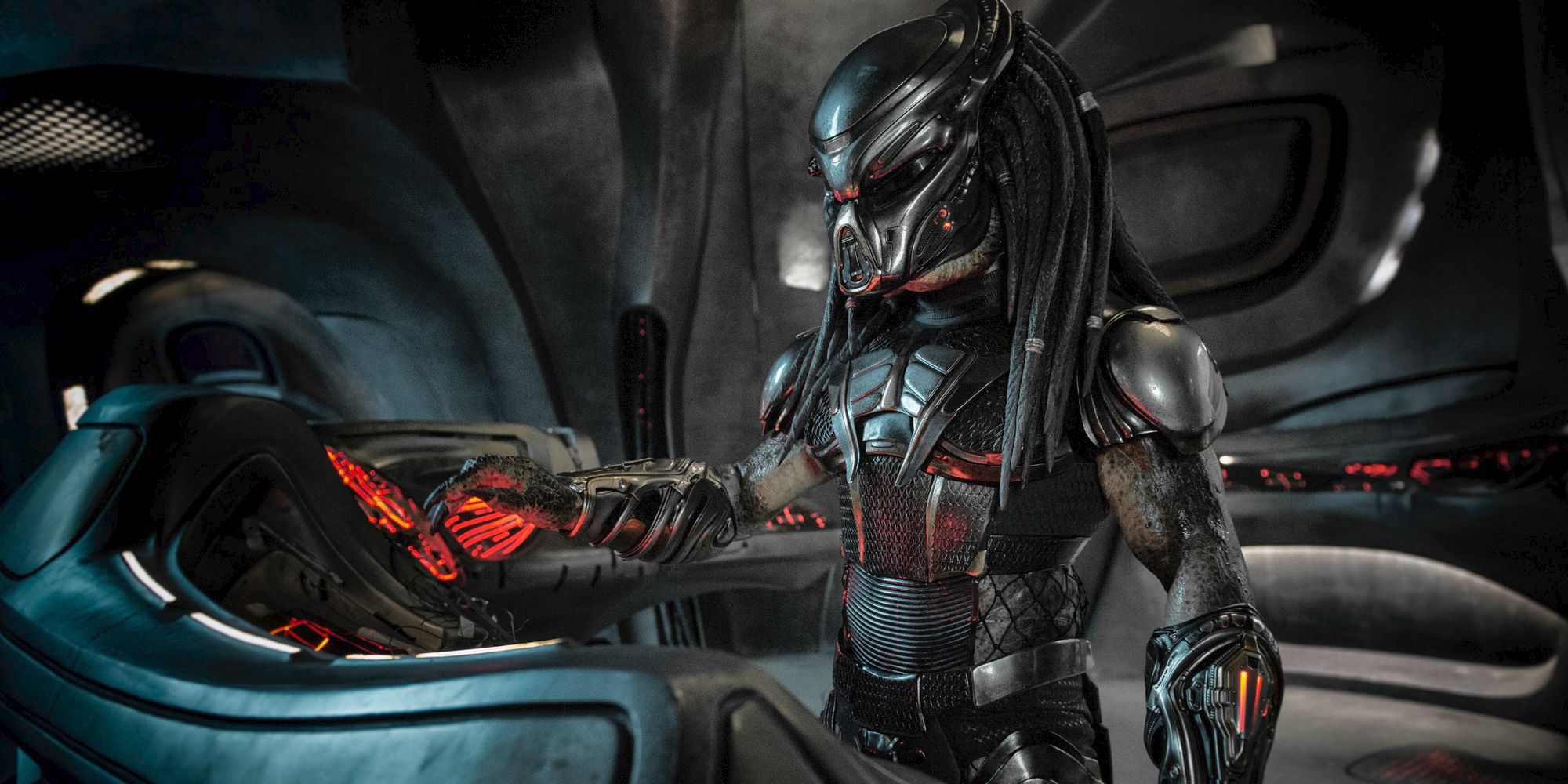 The Predator at a ship console, from The Predator (2018)