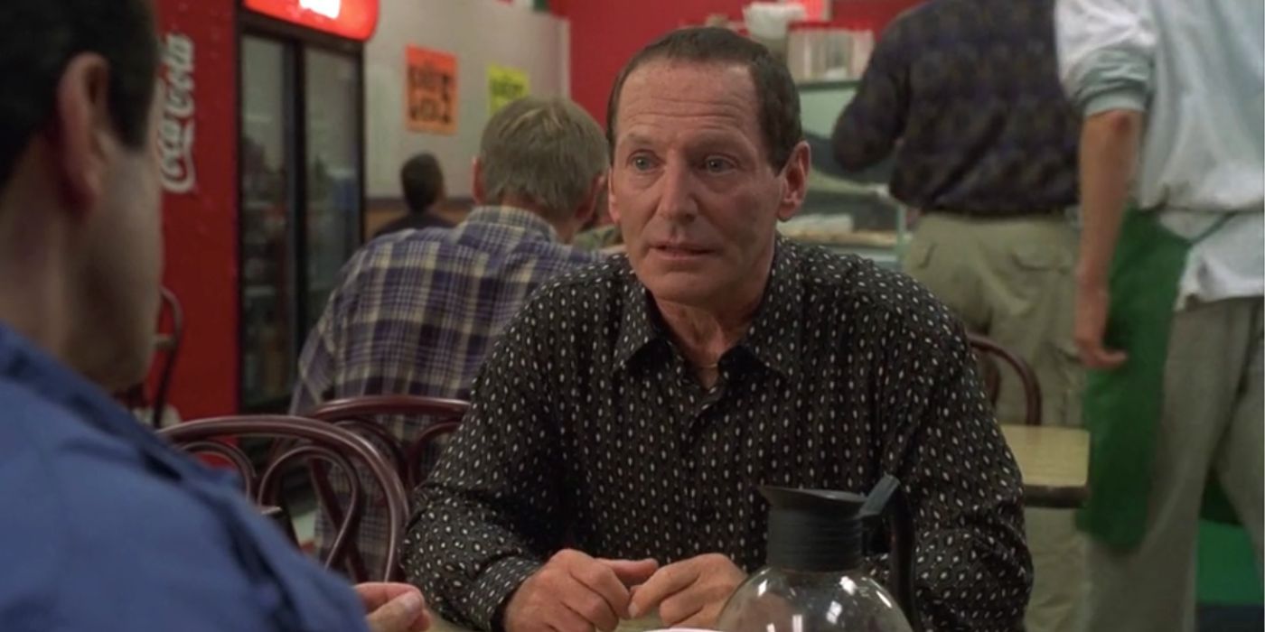 Peter Gaeta sitting at a table in The Sopranos