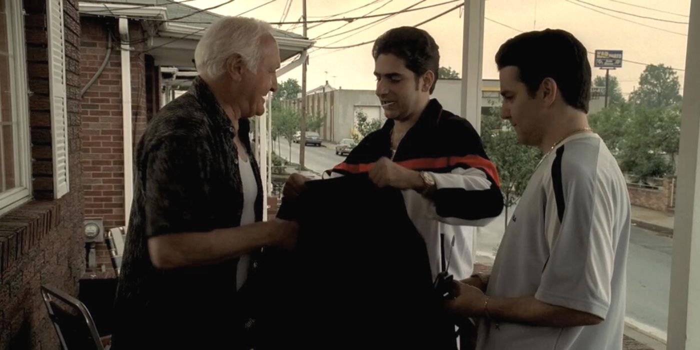 Robert Loggia looking at suit with Michael Imperioli and Max Casella on his porch in The Sopranos