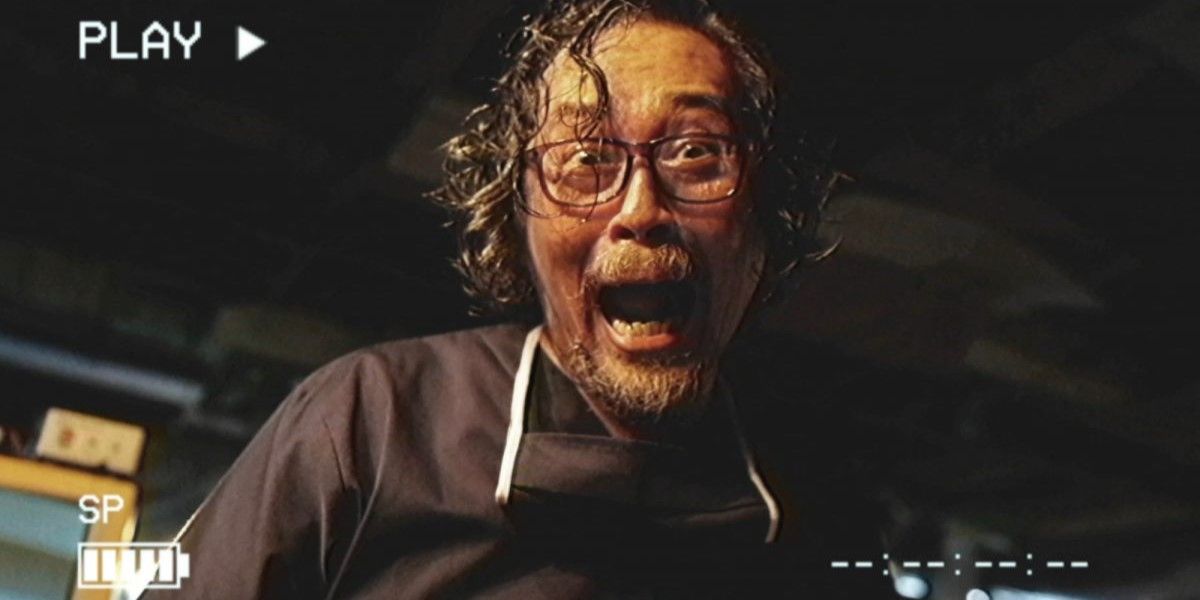 Image from VHS/94: a man screams at the camera on a recording display.