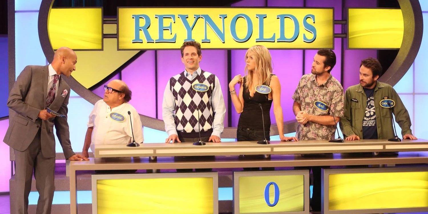 Still from 'It's Always Sunny in Philadelphia': The Gang and the game show host (Keegan-Michael Key) stand on a Family Feud-esque set.