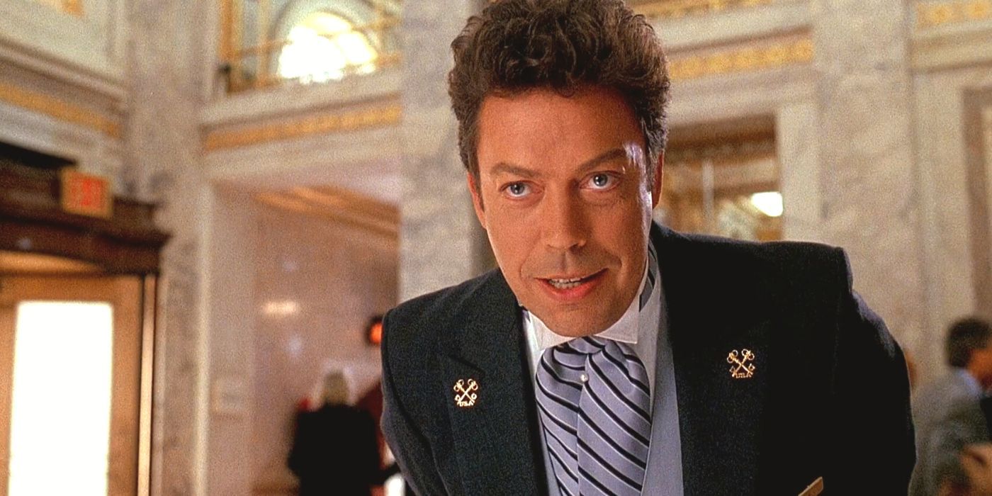 Tim Curry leaning over while talking to someone in Home Alone 2 (1992)