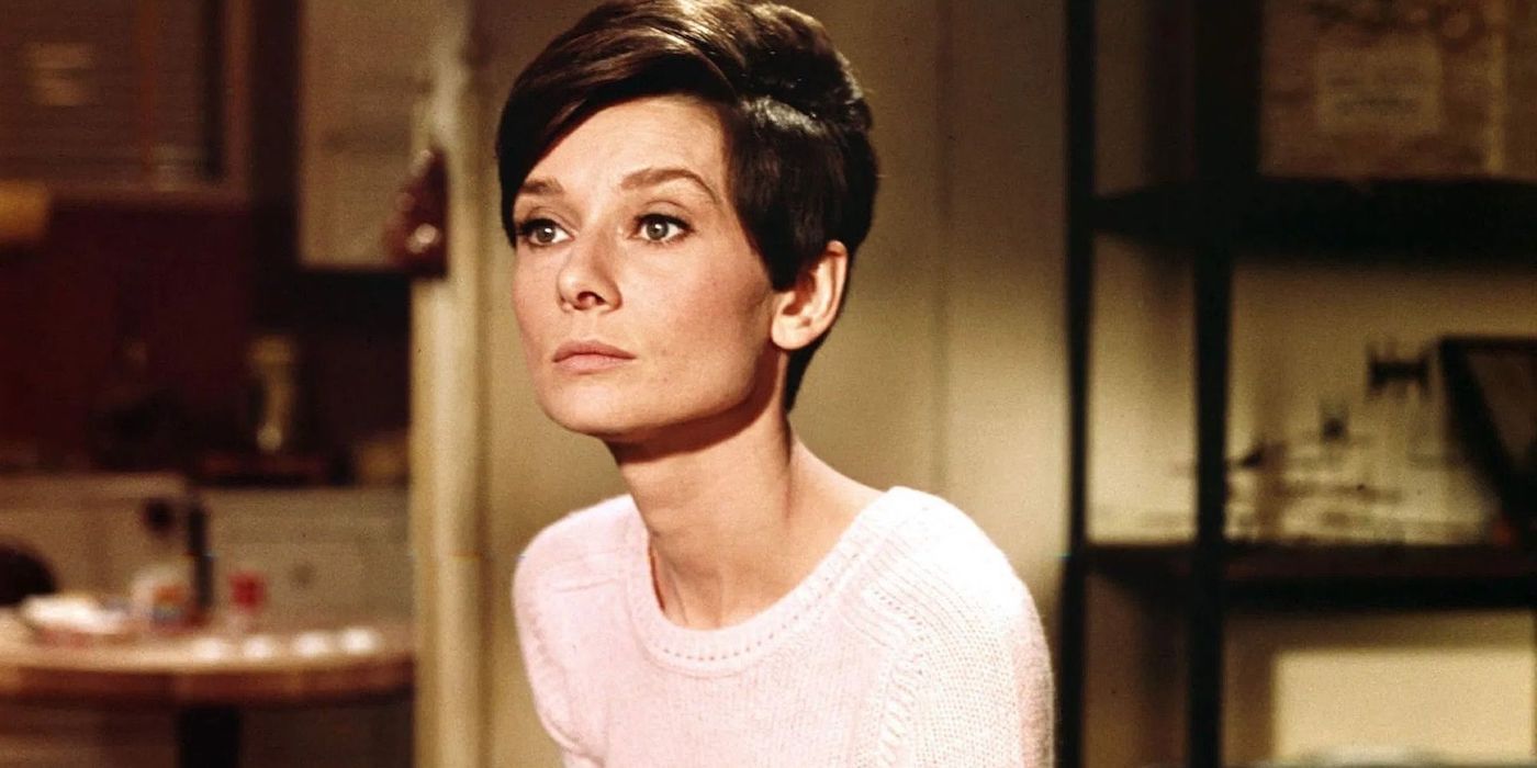 Audrey Hepburn as Susy sitting stoically in Wait Until Dark