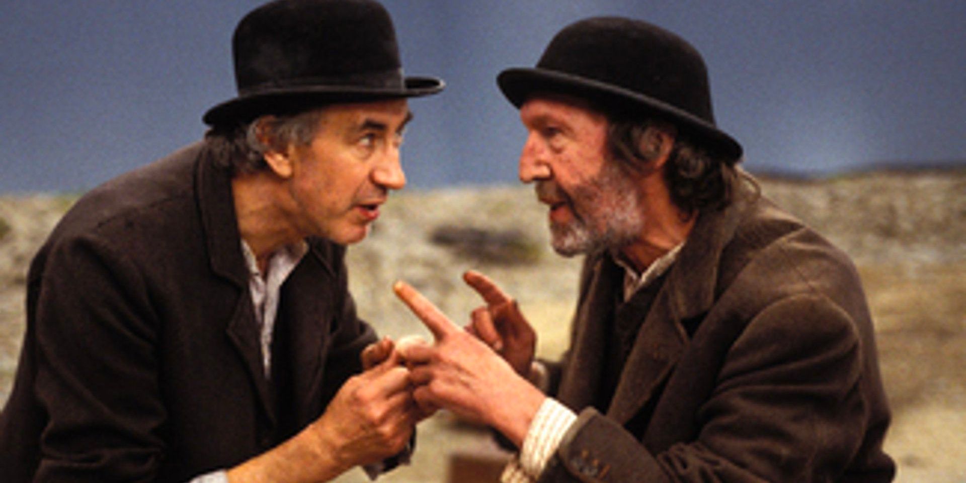 Two old tramps bicker with each other as they wait for a mysterious man in 'Waiting for Godot'.