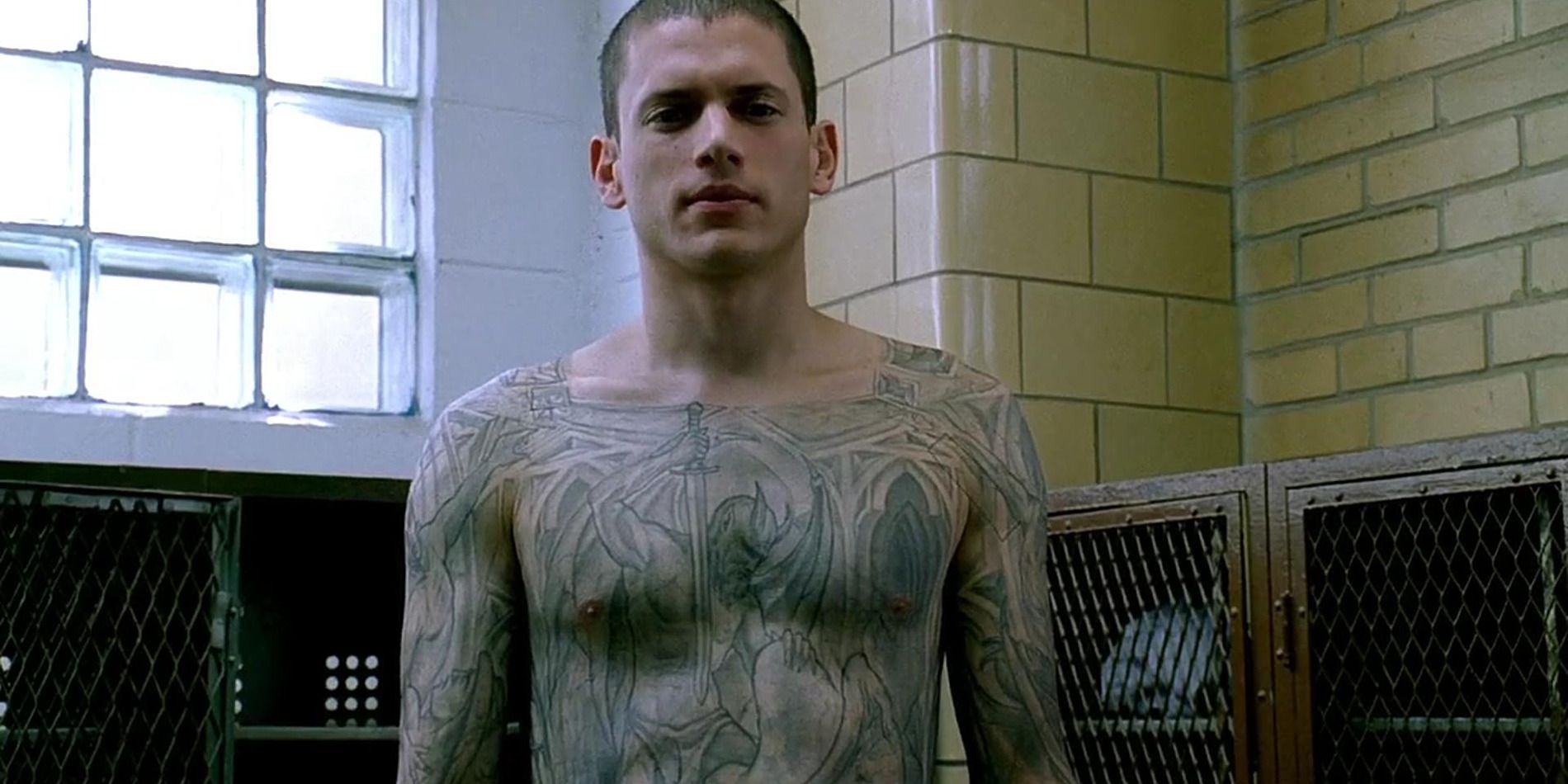 Michael Scofield showing his tattoos in prison