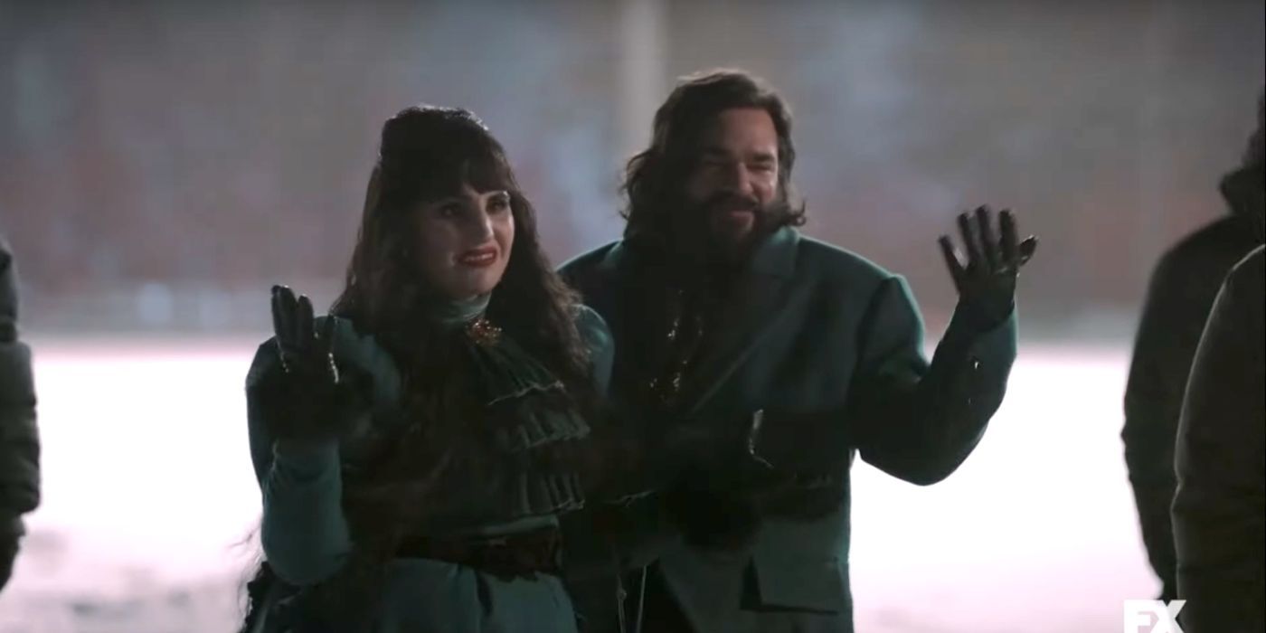 Nadja, played by Natasia Demetriou, and Laszlo, played by Matt Berry, in the snow in What We Do in the Shadows.