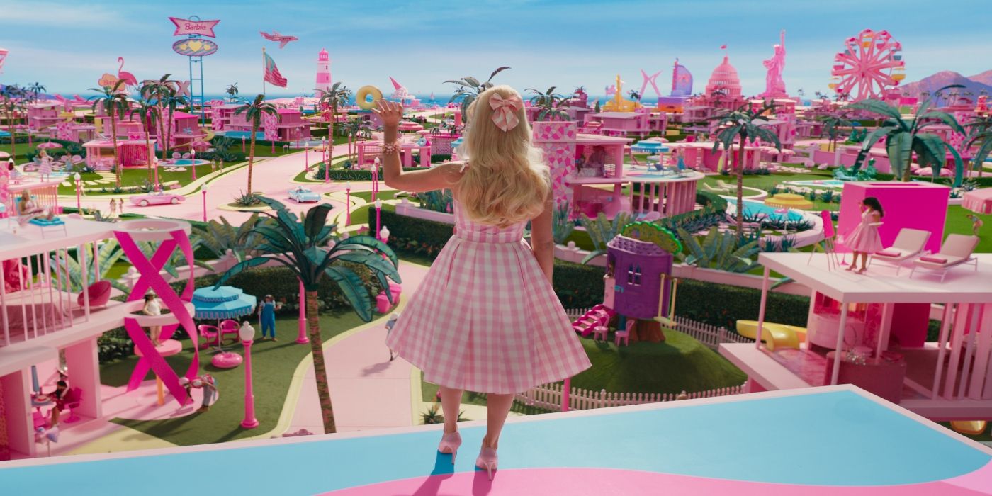 Barbie waving down at Barbieland in Barbie