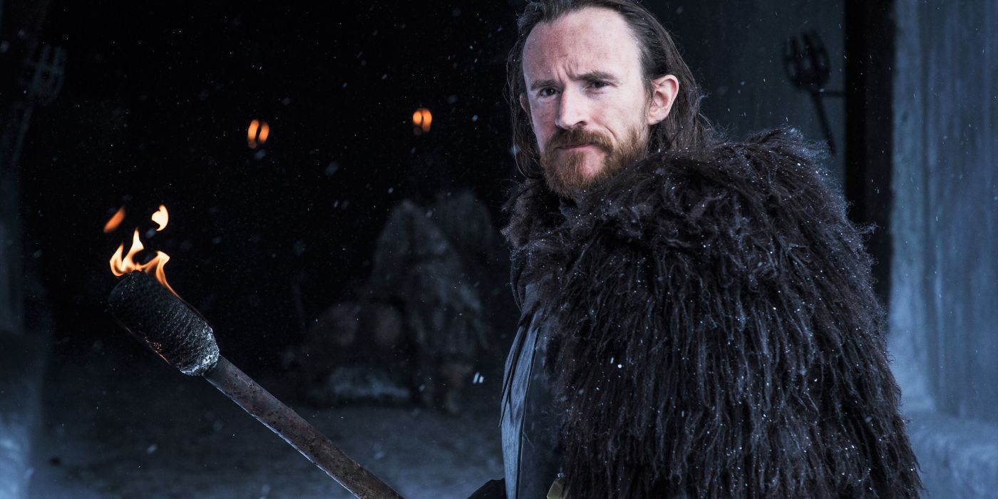 Ben Crompton as Eddison Tollett holding a torch in Game of Thrones