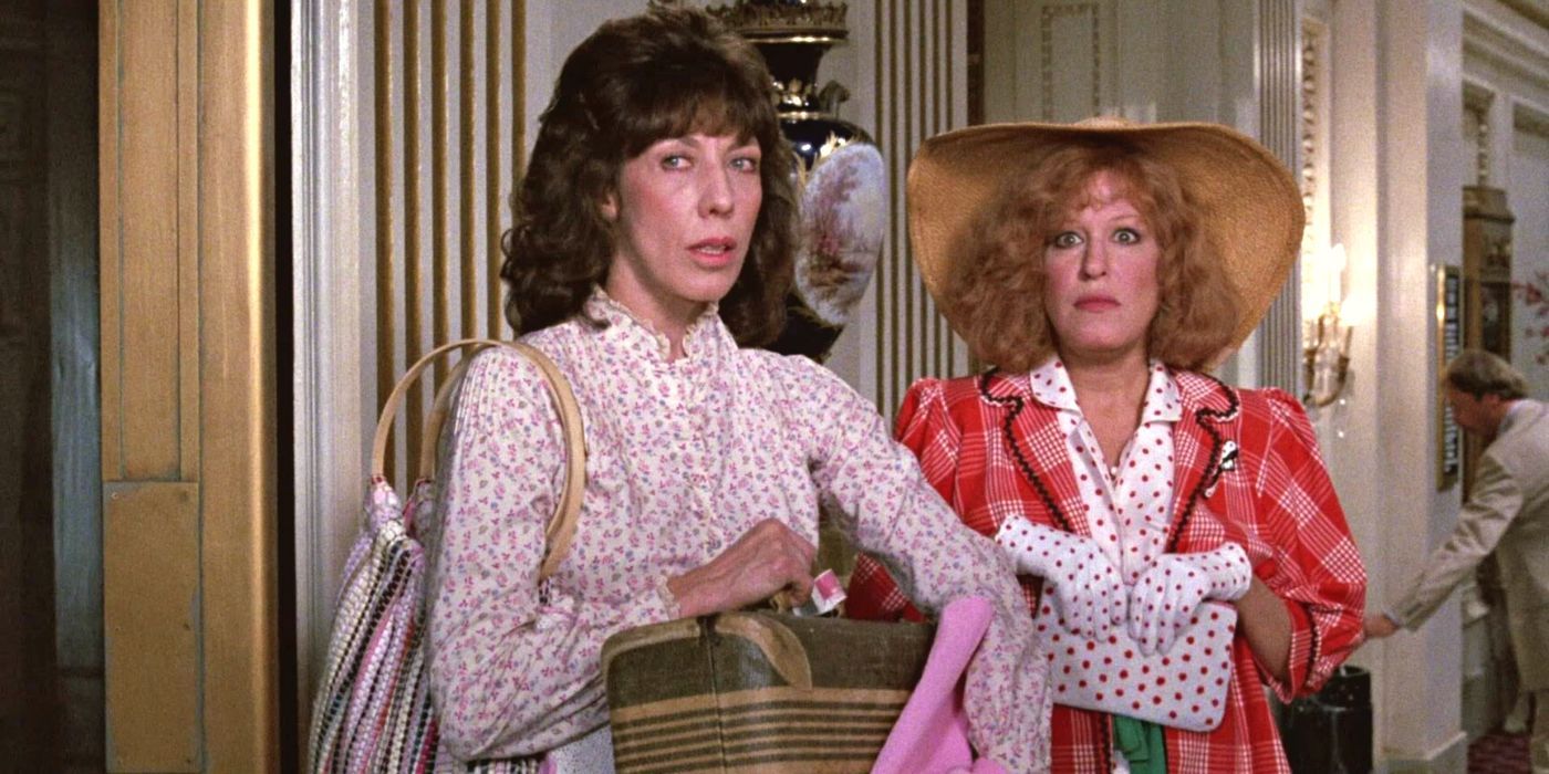 Bette Midler and Lily Tomlin standing by an elevator in Big Business (1988)