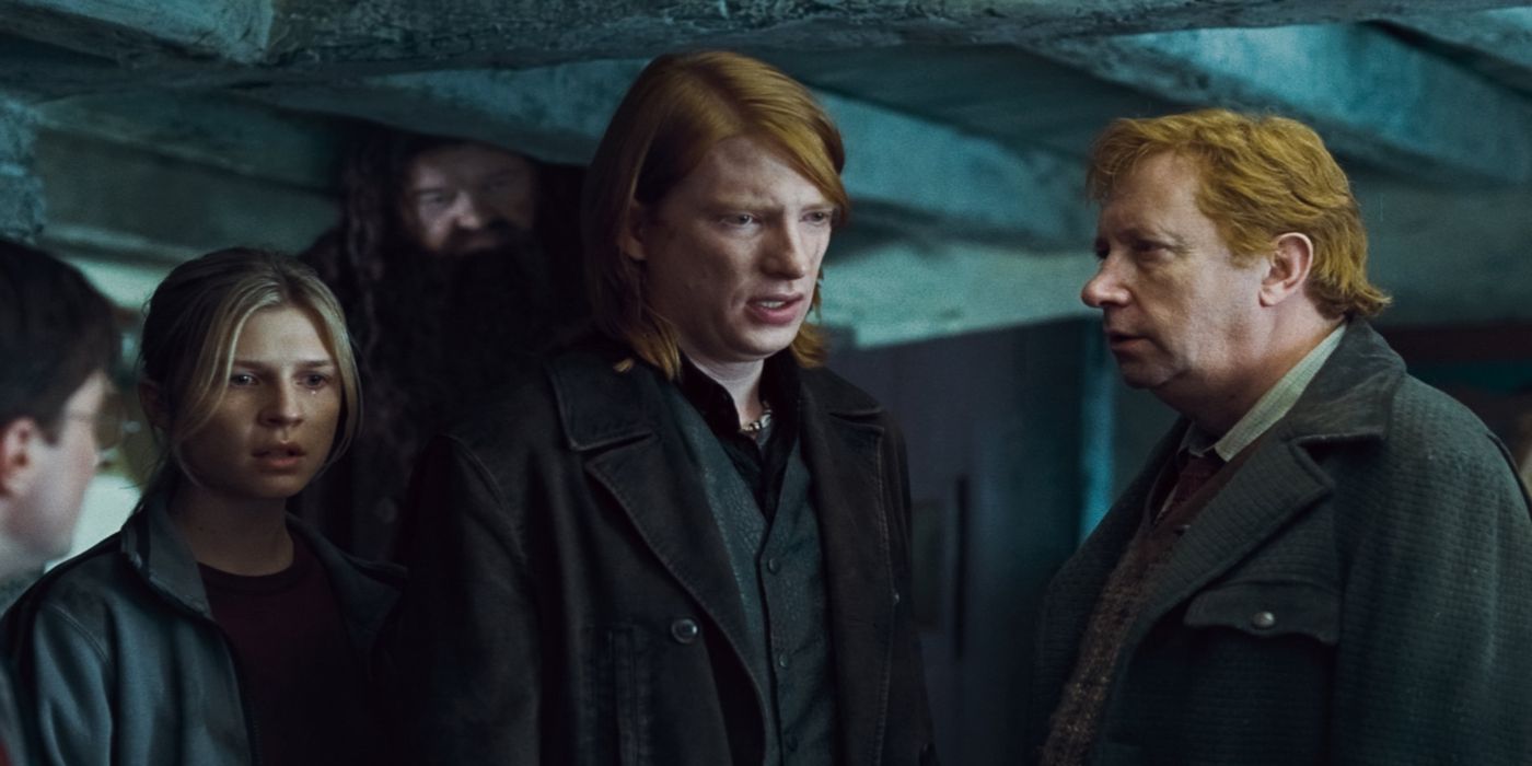 A sad Bill Weasley (Domhnall Gleeson) talking while Arthur (Mark Williams) and Fleur (Clémence Poésy) stand beside him in Harry Potter and the Deathly Hallows — Part 1