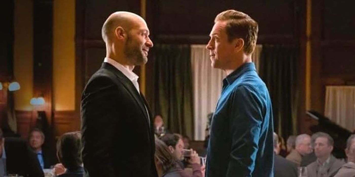 Mike smiling at Axe in Billions, the two standing face to face.