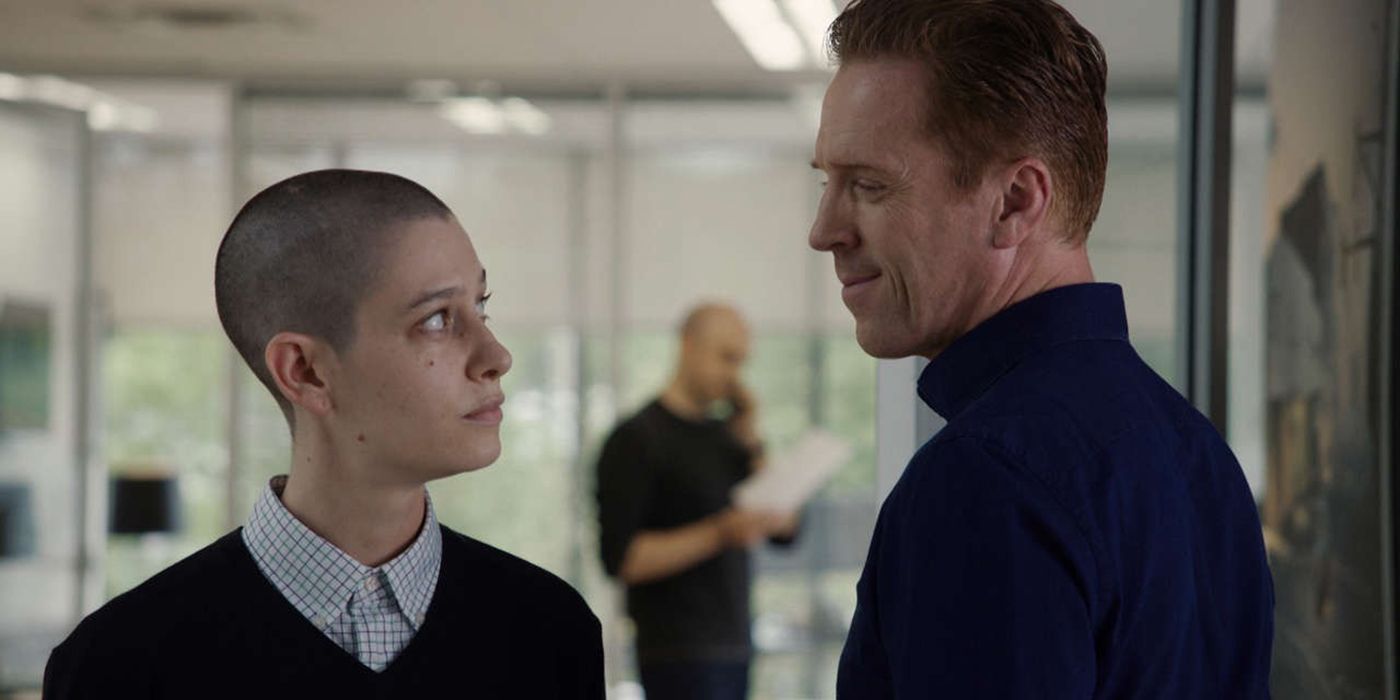 Taylor and Axe looking at one another in a scene from Billions.