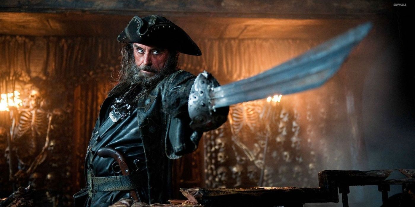 Ian Mcshane as Blackbeard in 'Pirates of the Caribbean: On Stranger Tides' pointing his sword to a target offscreen