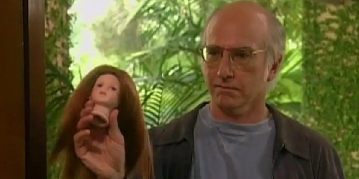 Larry holds a doll head on 'Curb Your Enthusiasm'