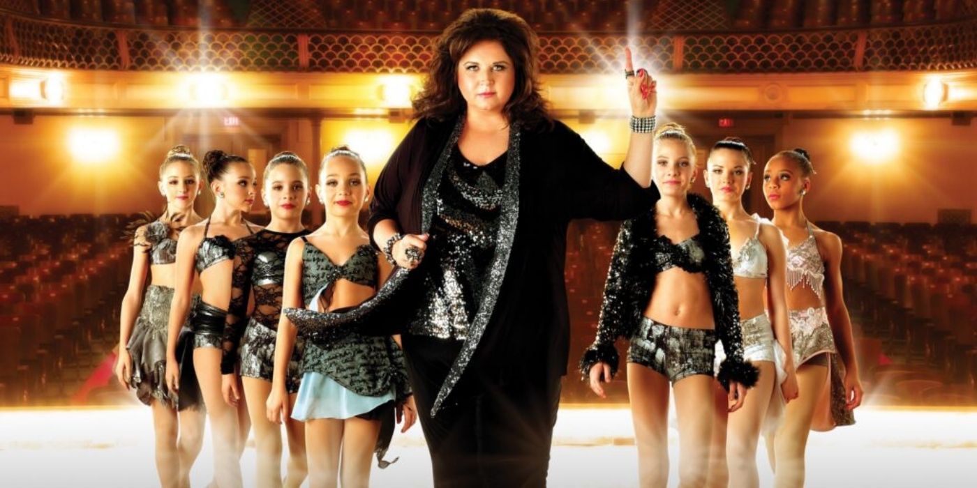 Abby Lee Miller stands in the middle of the 'Dance Moms' children.