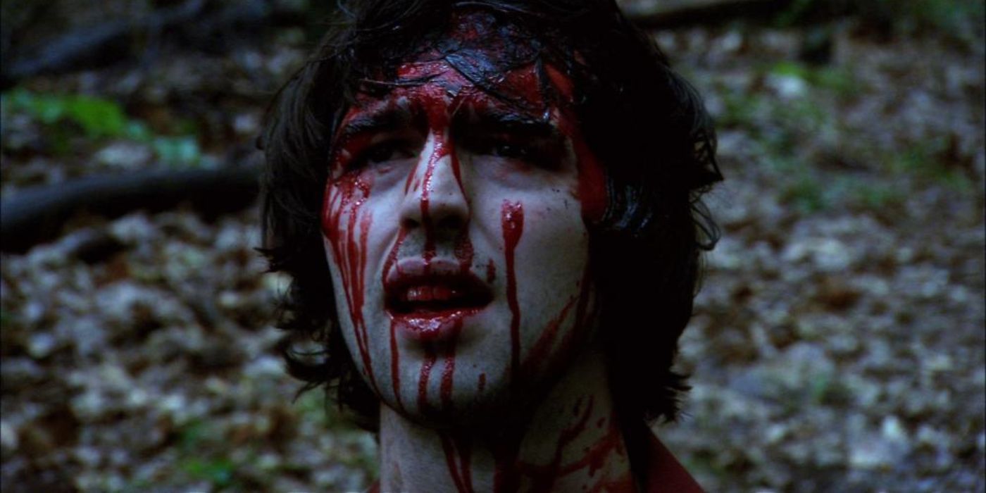 A young man with blood on his face in Don't Go Into the Woods 2010