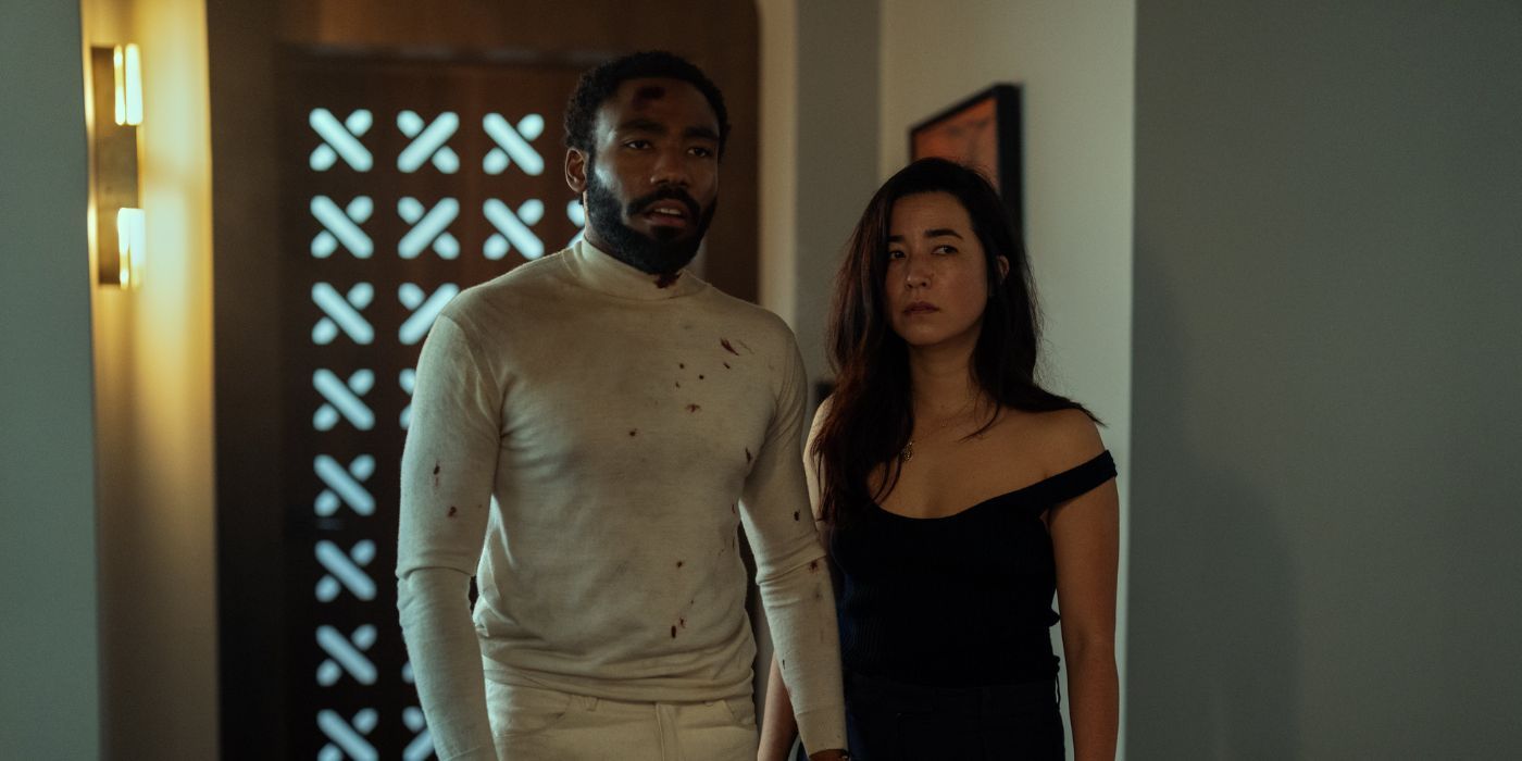 Donald Glover and Maya Erskine looking ahead in Mr. & Mrs. Smith