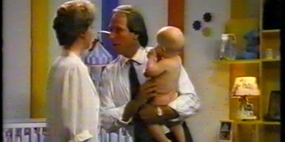 Dr. Grace Murdock and Zach Shepard with a baby