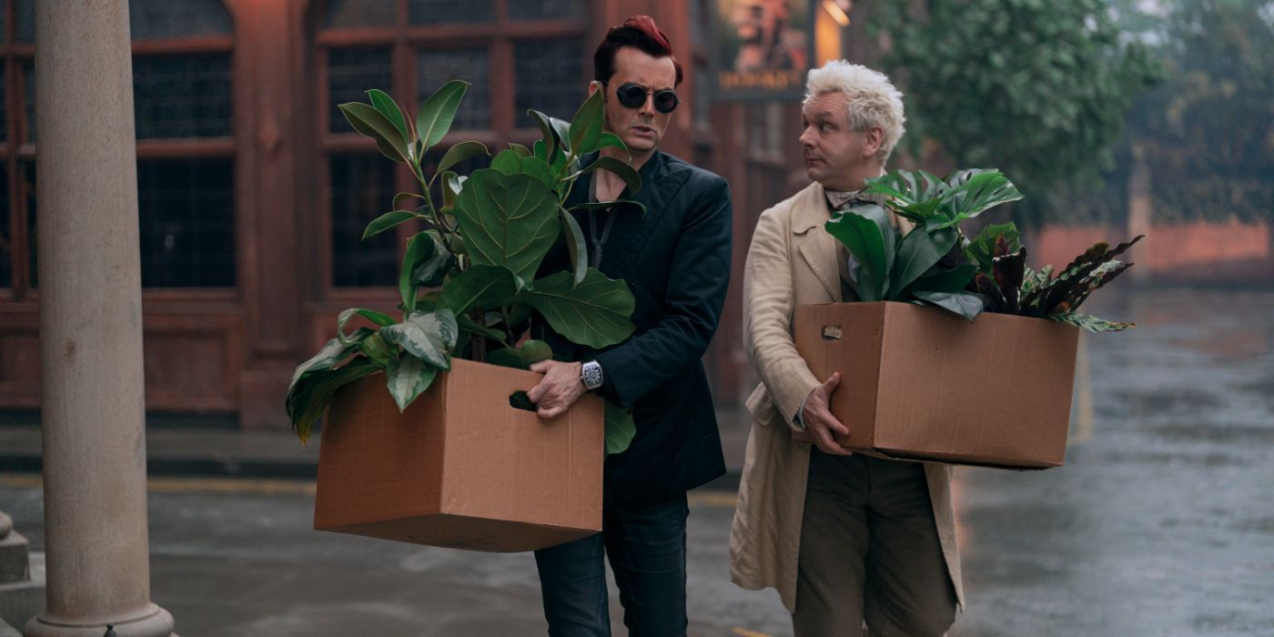 Crowley (David Tennant) and Aziraphale (Michael Sheen) carrying plants in Good Omens Season 2