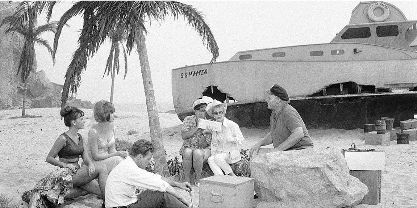 The castaways sitting in front of the wreck of the S.S. Minnow in 'Gilligan's Island'