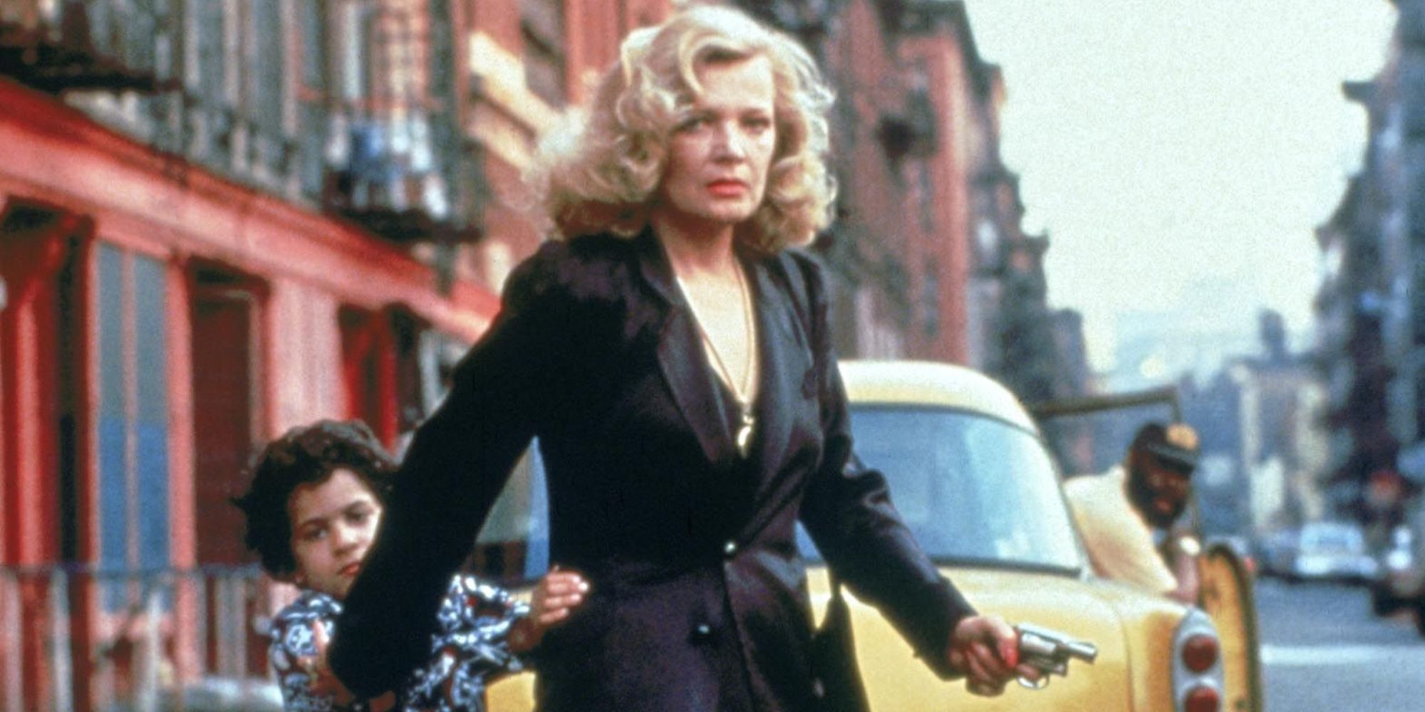 Gena Rowlands as Gloria Swenson crossing a street while holding a gun in the film Gloria - 1980