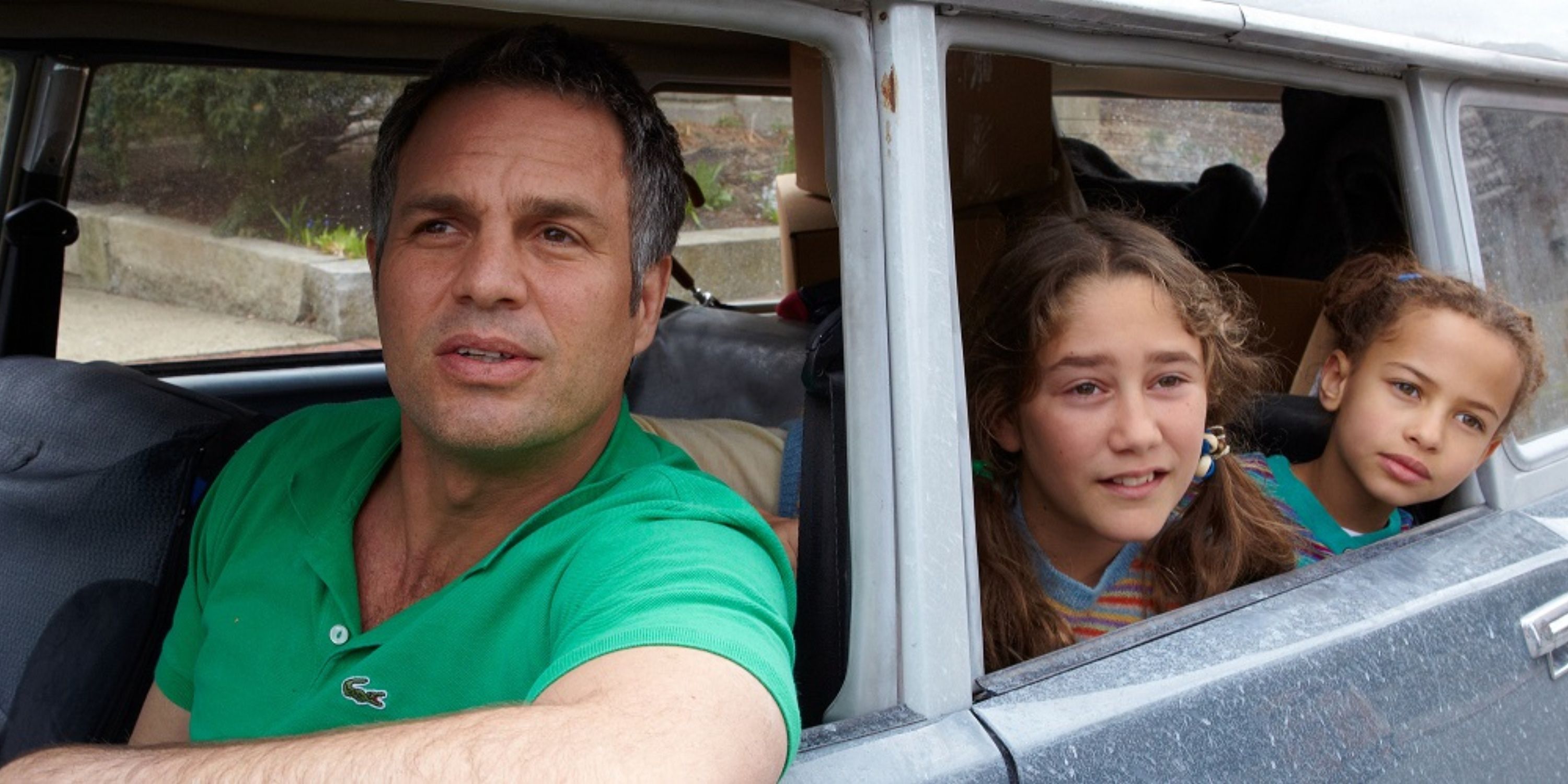 Mark Ruffalo as Cameron looking out the car window with two young children in the back in Infinitely Polar Bear