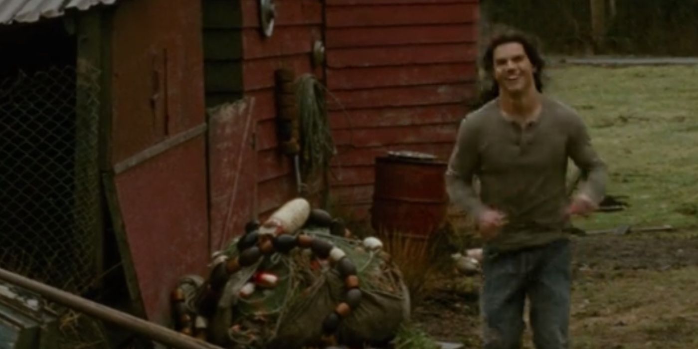 Jacob (Taylor Lautner) running toward Bella with a smile on his face during the 