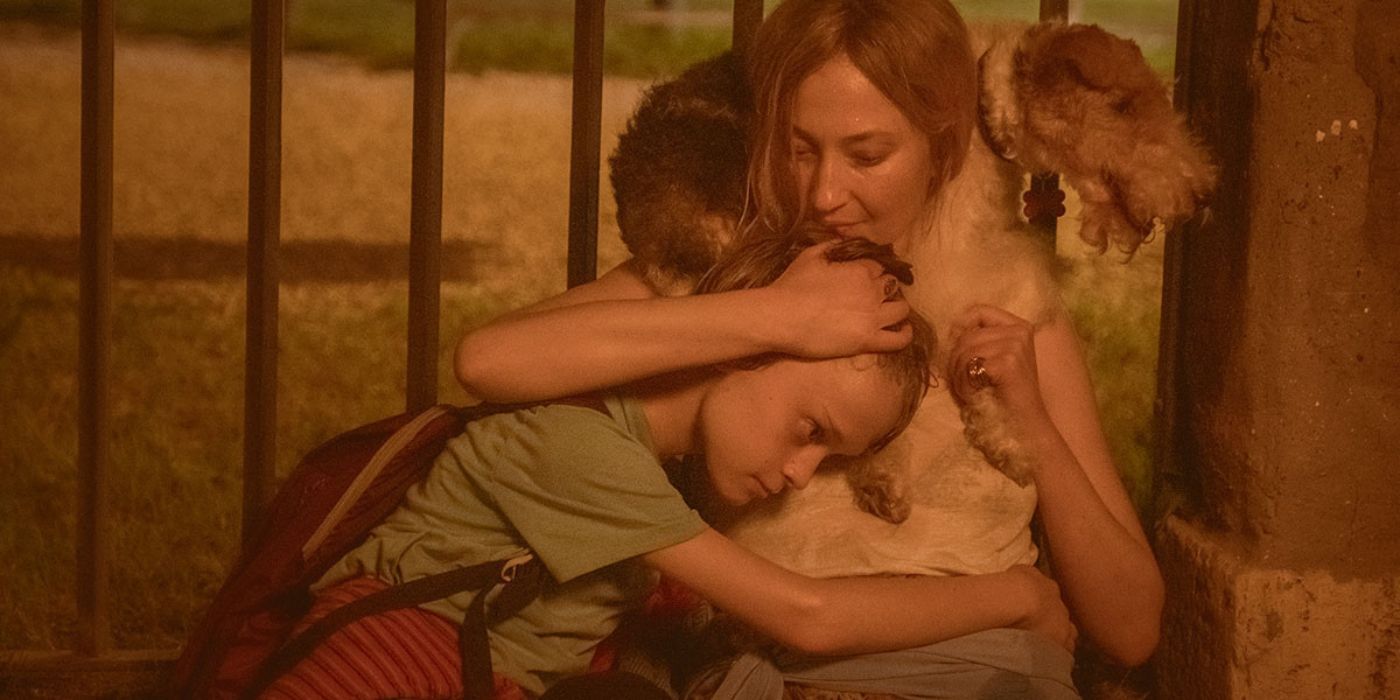 Alba Rohrwacher as Caterina holding son Max in I Told You So