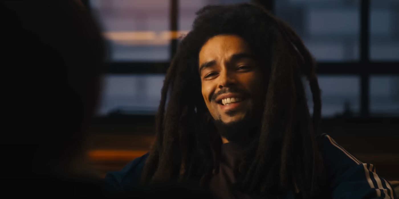 Close up of Kingsley Ben-Adir as Bob Marley smiling in Bob Marley: One Love