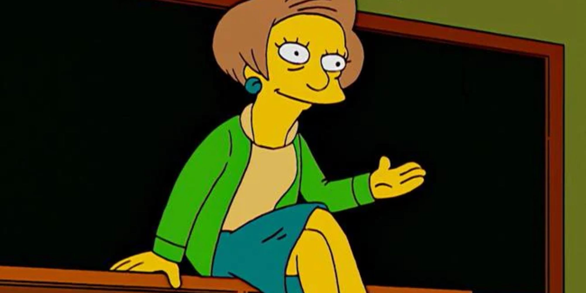 Krabbapel sits on her desk