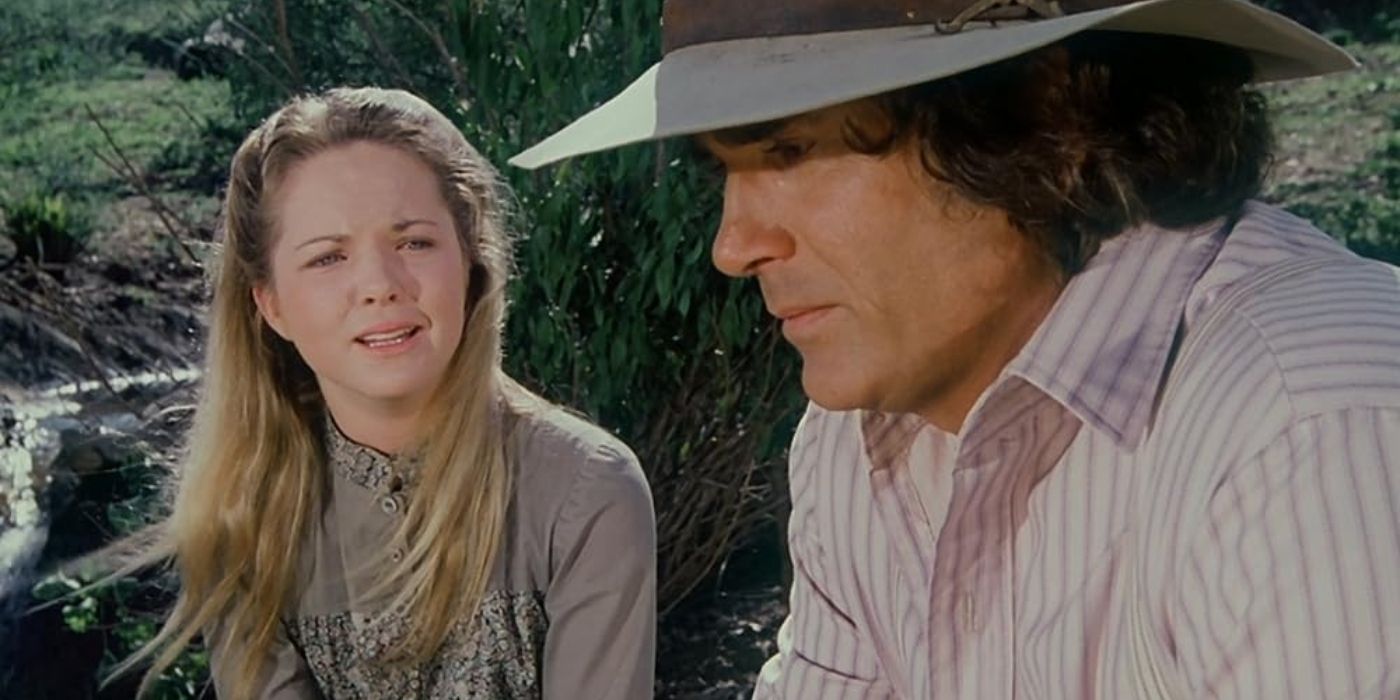 Mary Ingalls (Melissa Sue Anderson) crying while and Charles Ingalls (Michael Landon) looks away sadly in Little House on the Prairie