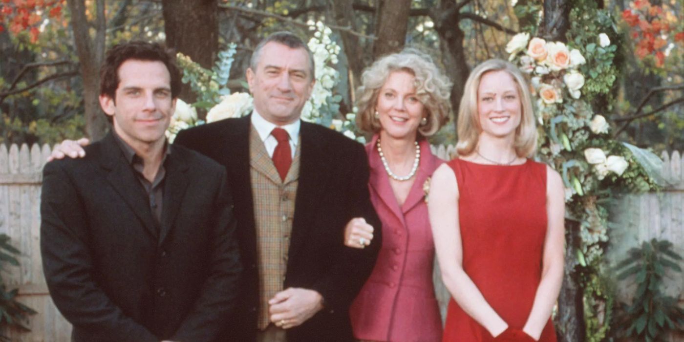 Greg and the Byrnes smiling for a photo in the film Meet the Parents.