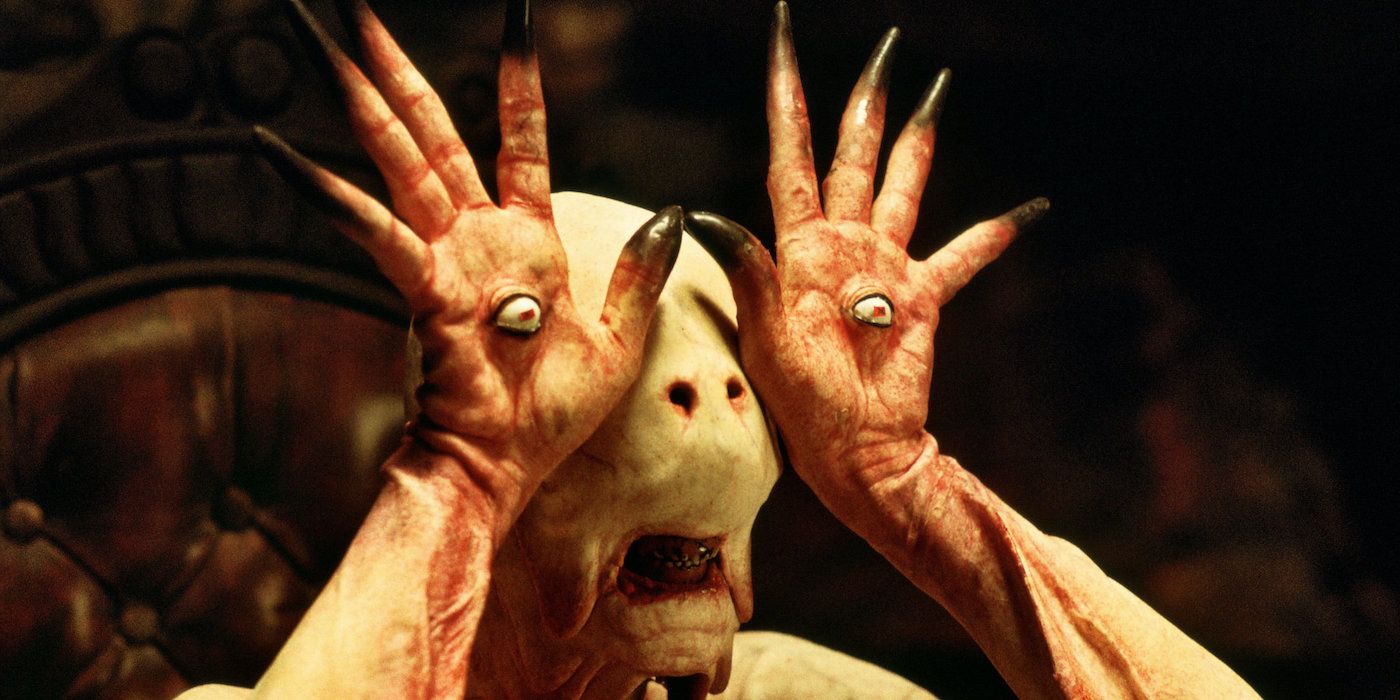 The Pale Man showing off the eyeballs on the palms of his hands in 'Pan's Labyrinth'