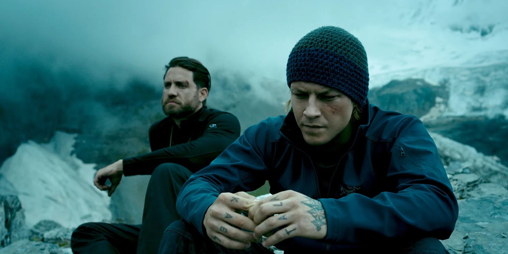 Edgar Ramirez and Luke Bracey sit atop a cold mountain in Point Break