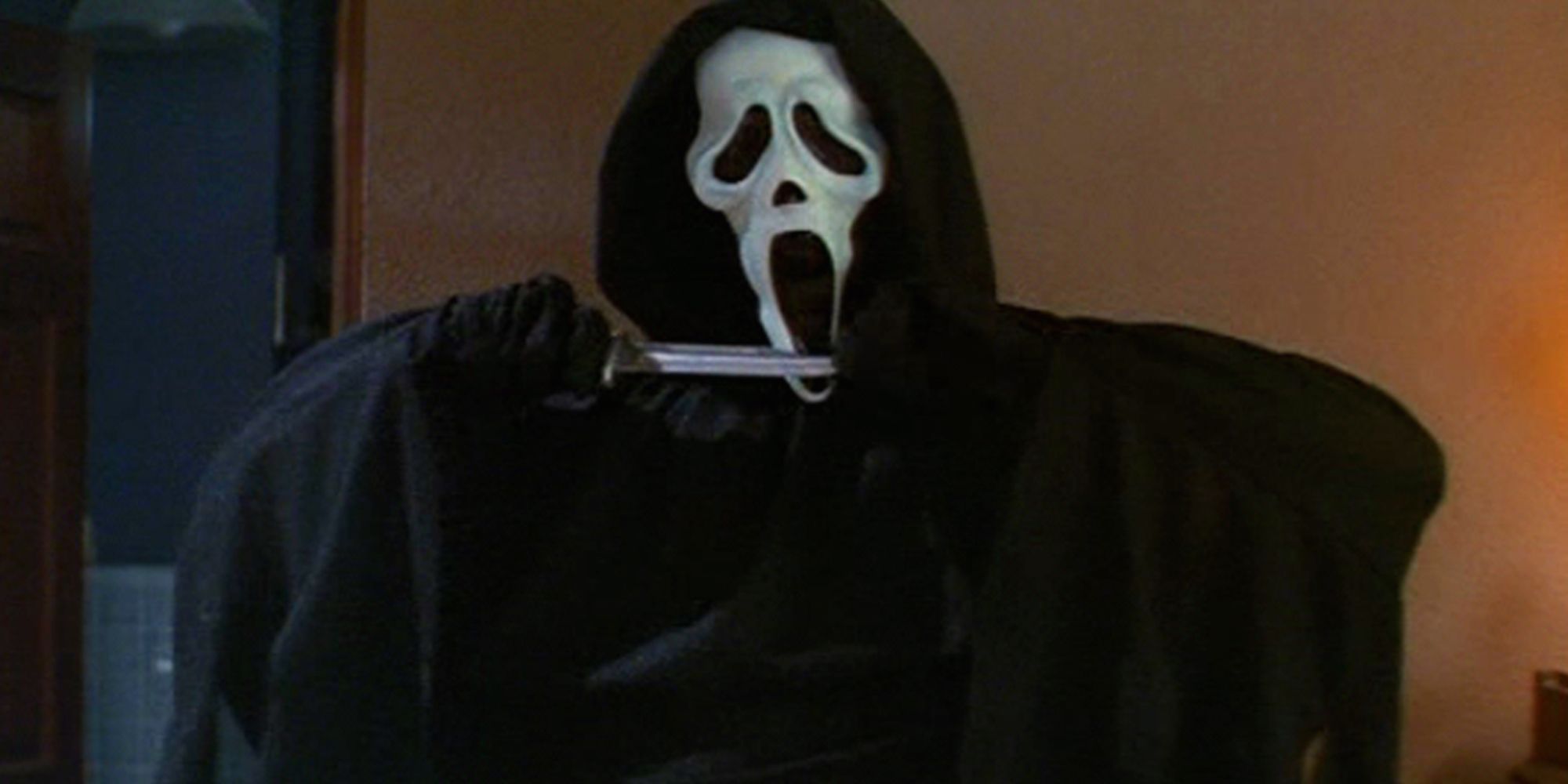 Ghostface wipes their bloody knife in Scream