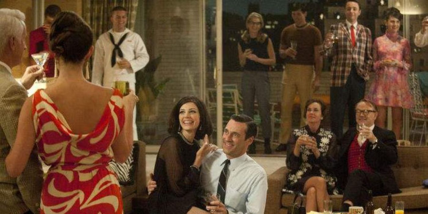 Don and Megan Draper laughing at a party in Season 5 Mad Men 