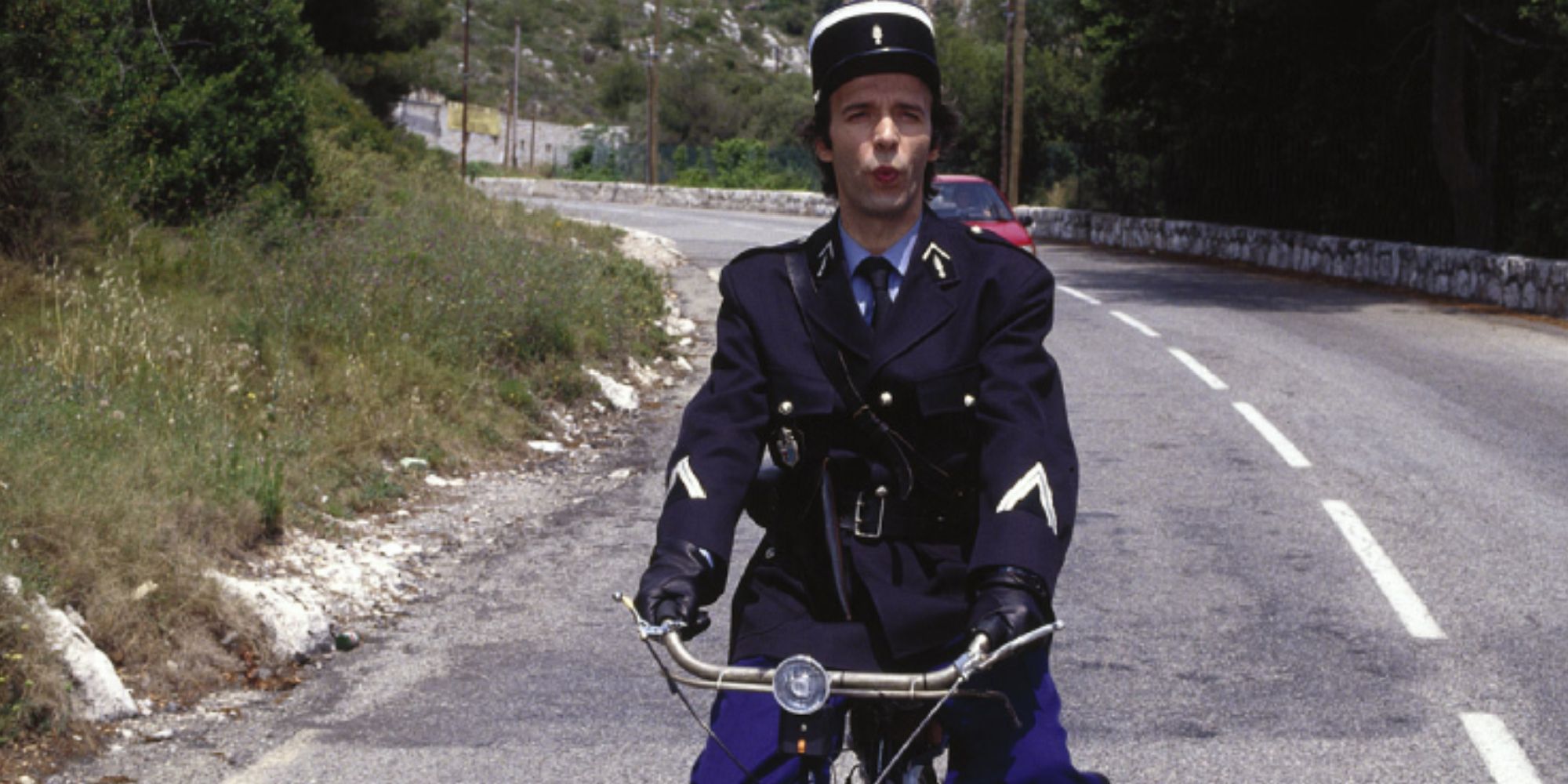 A police man on a scooter in Son of the Pink Panther - 1993