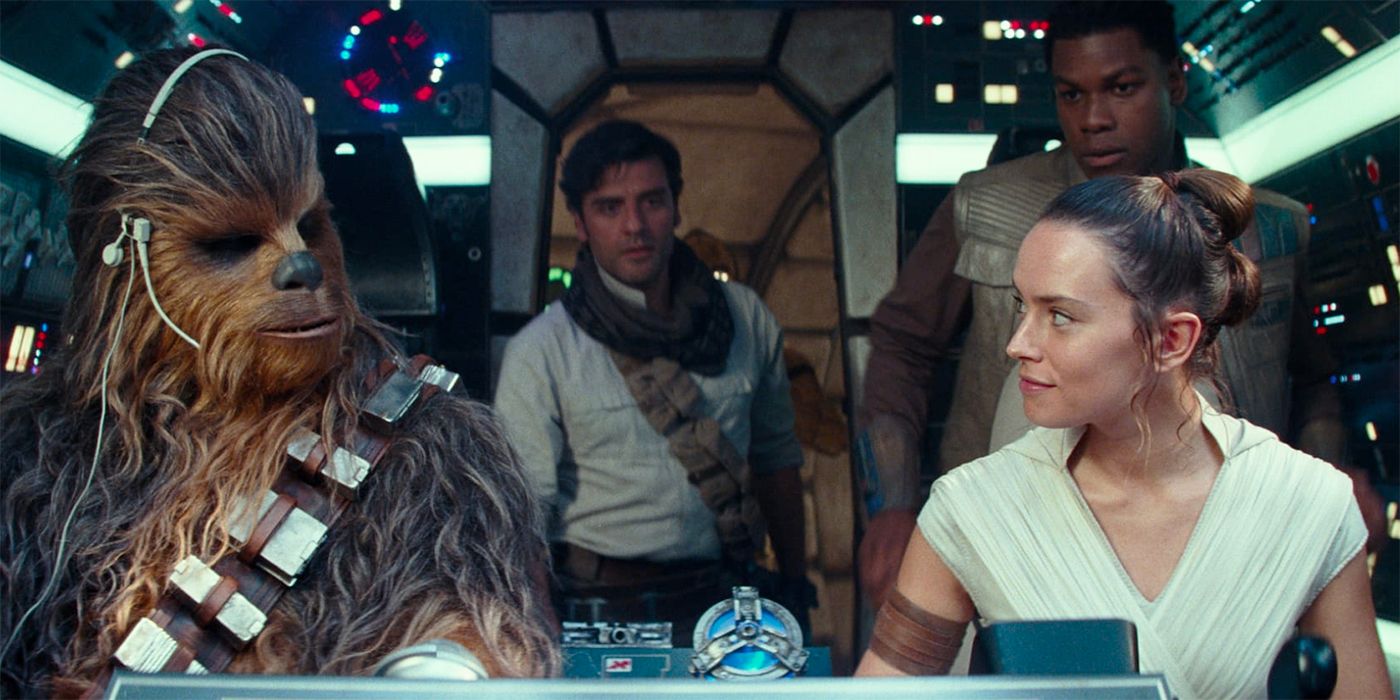 Rey (Daisy Ridley) looking at Chewbacca with Poe (Oscar Isaac) and Finn (John Boyega) in the background in Star Wars: The Rise of Skywalker
