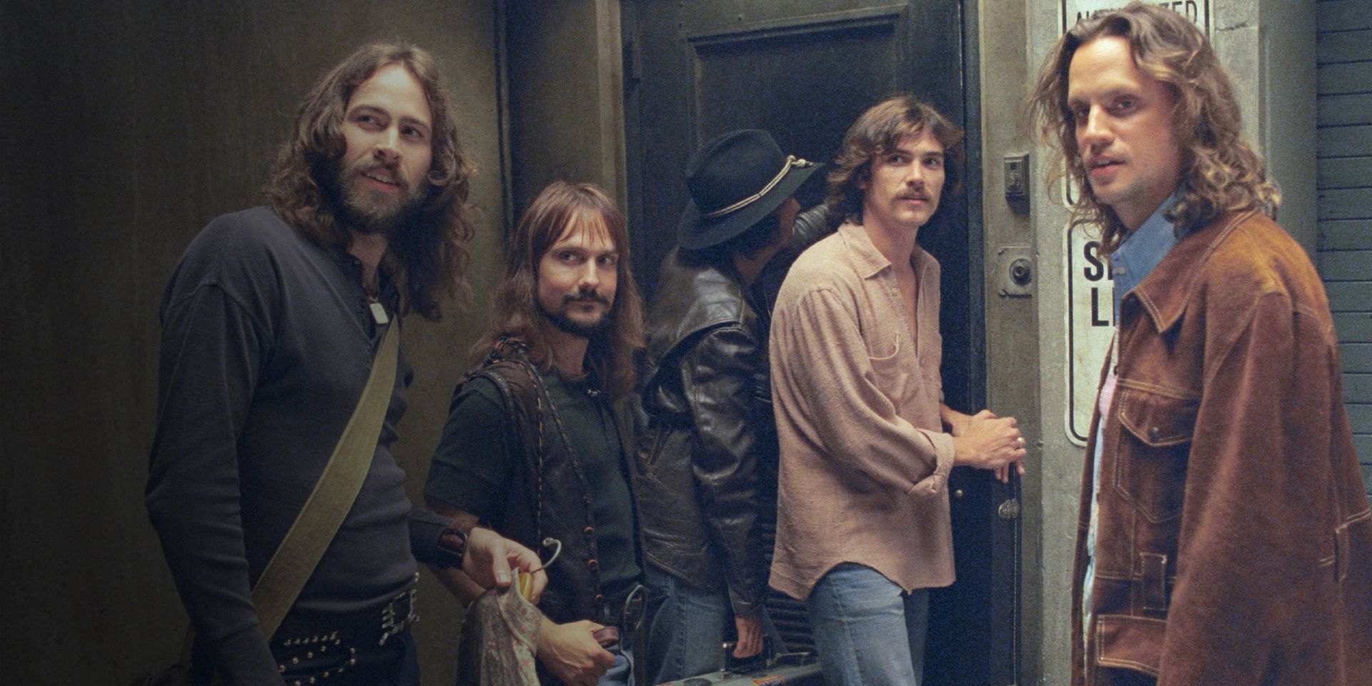 Jeff Bebe (Jason Lee), Ed Vallencourt (John Fedevich), Dick Roswell (Noah Taylor), Russell Hammond (Billy Crudup), and Larry Fellows (Mark Kozelek) in Almost Famous