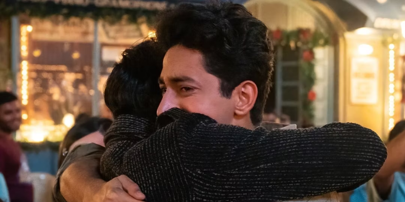 Two men hugging in the archies BTS photo