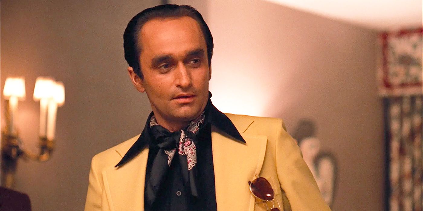 John Cazale as Fredo wearing a suit and staring in The Godfather