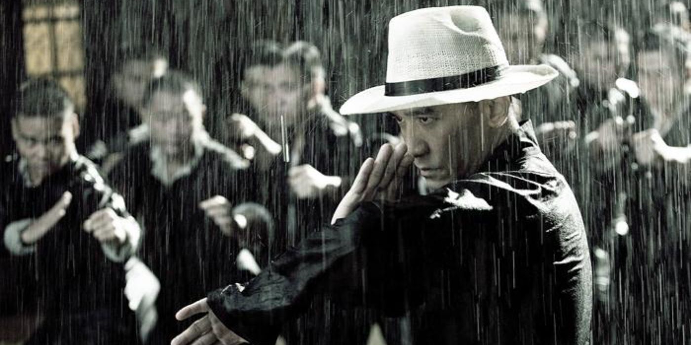A man in attack position under the rain in The Grandmaster