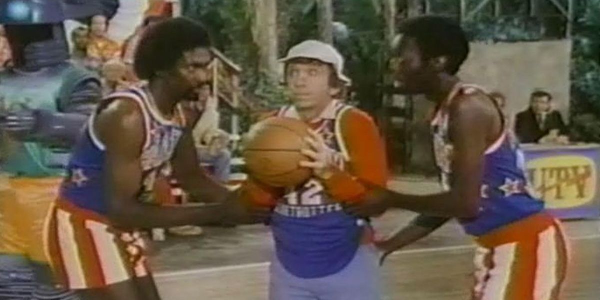 Gilligan (Bob Denver) alongside two Globetrotters in 'The Harlem Globetrotters on Gilligan's Island'