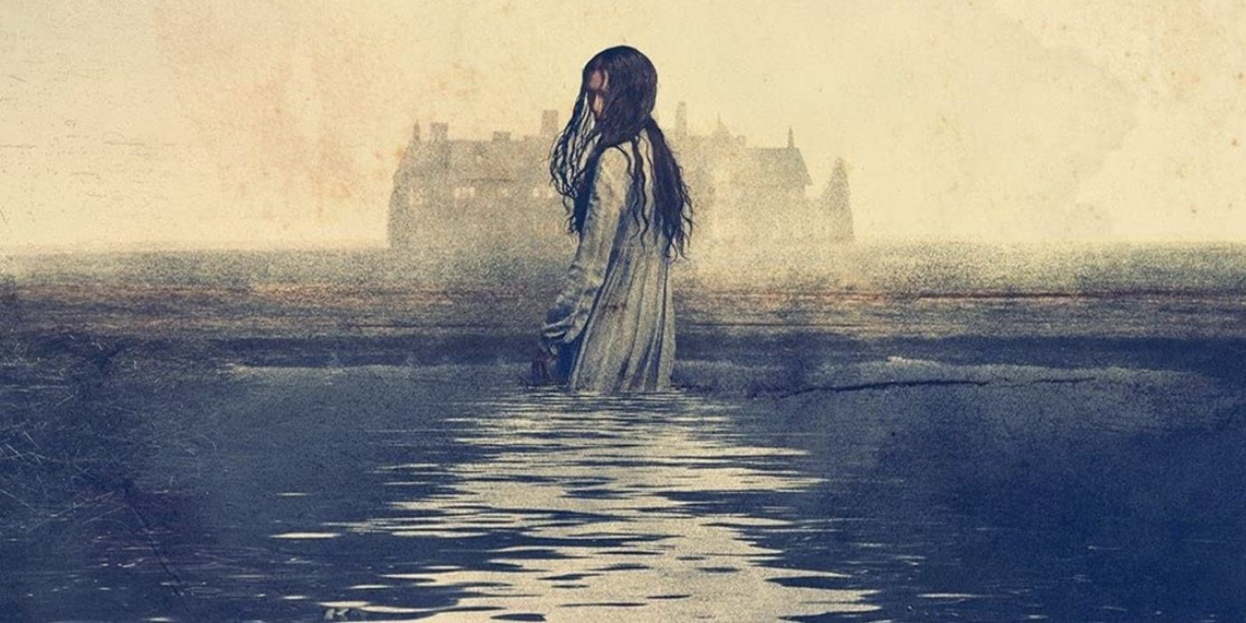 A woman stands in water with a mansion in the far distance in a poster for The Haunting of Bly Manor.