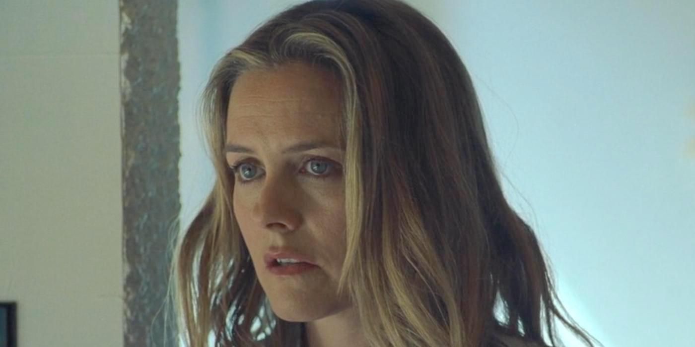 Alicia Silverstone as Laura Hall looking at a person offscreen in The Lodge