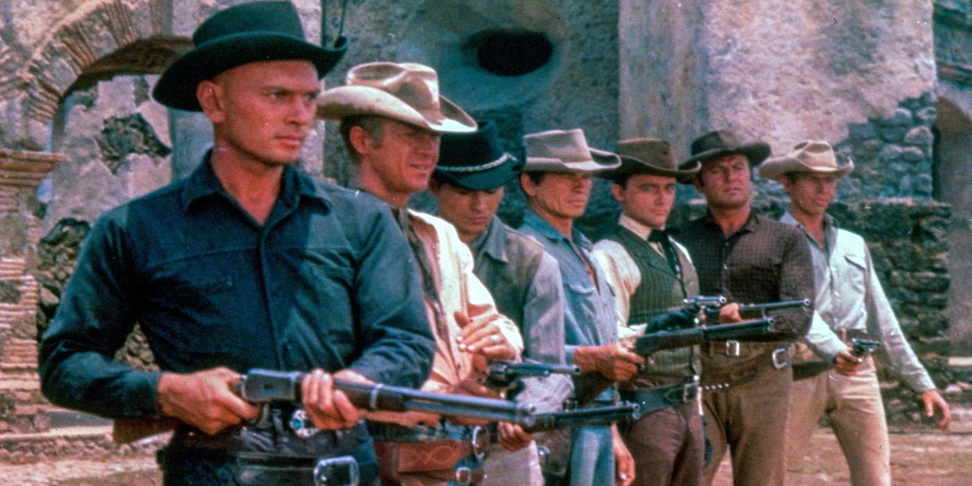 the magnificent seven characters in line aiming their rifles ahead