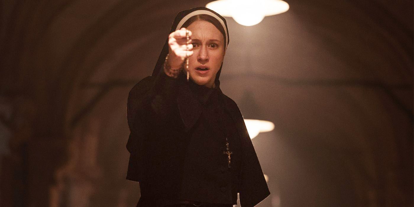 Taissa Farmiga clutching a cross as Sister Irene in The Nun II