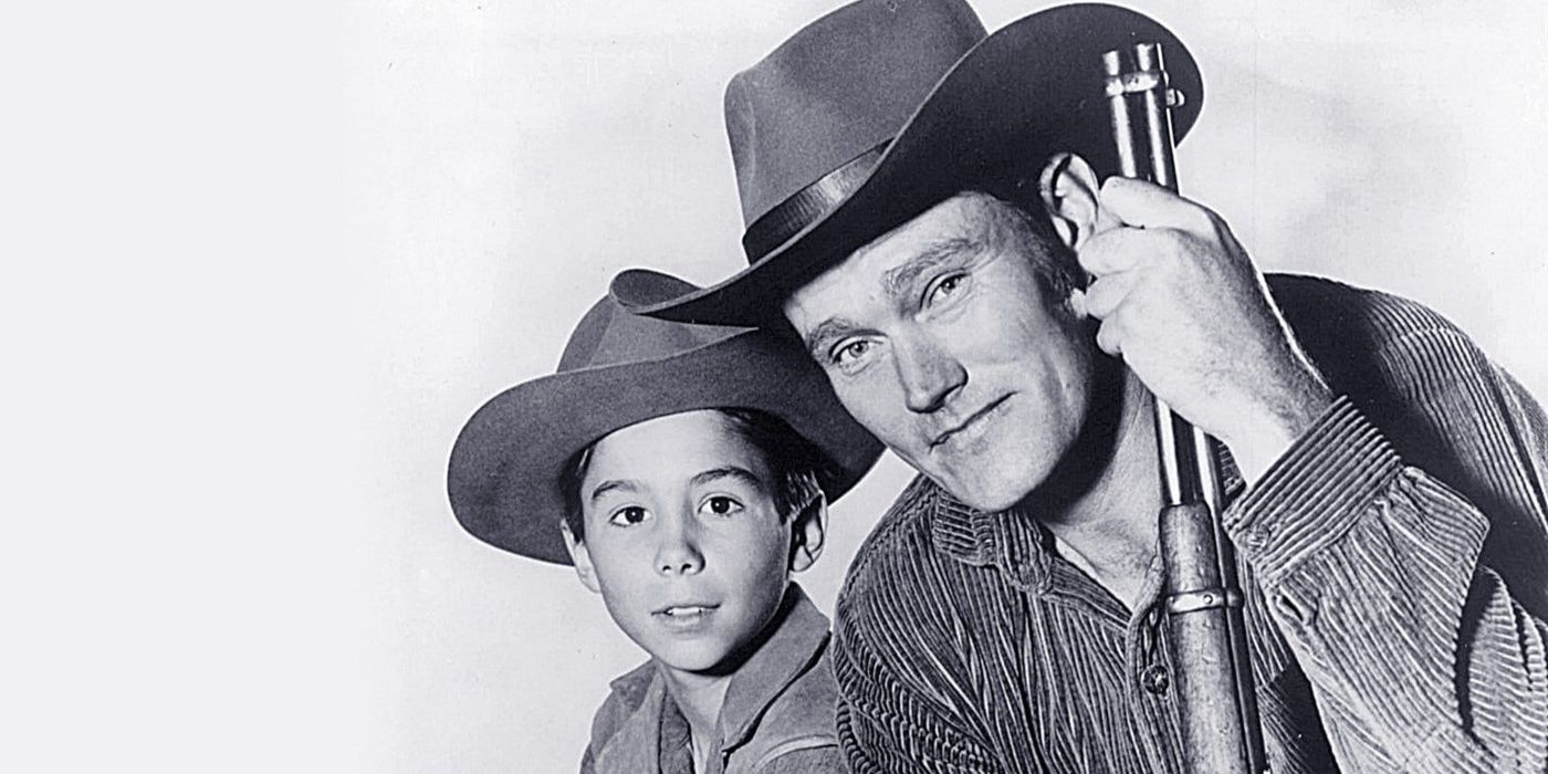 Johnny Crawford as Mark McCain and Chuck Connors as Luke McCain in 'The Rifleman.'