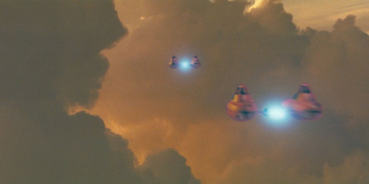 Twin-Pod Cloud Cars flying between the clouds of Bespin