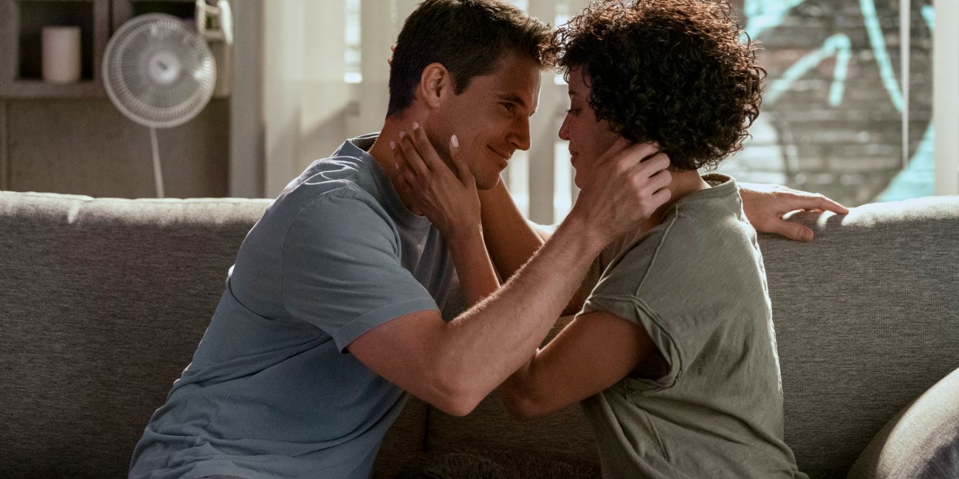 Nathan (Robbie Amell) and Nora (Andy Allo) hold each other in Upload Season 3